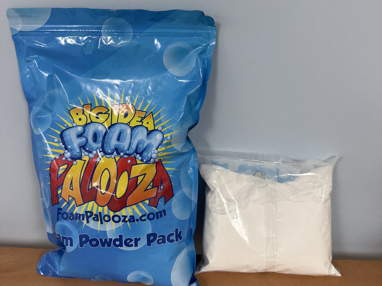 FoamPalooza triple-size pack next to a typical 10 oz foam powder pack